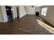 Open-concept living area with hardwood floors, fireplace, and bright windows at 2548 Sweet Birch Ct, Gastonia, NC 28054