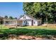 Quaint home featuring a fenced backyard and sun-drenched lawn at 60 Hunter Bridge Rd, Stony Point, NC 28678