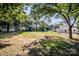 Expansive backyard showcasing lawn space and landscaping with a partial view of the house at 60 Hunter Bridge Rd, Stony Point, NC 28678