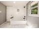 Bright bathroom showcasing white subway tile and soaking tub near window at 60 Hunter Bridge Rd, Stony Point, NC 28678