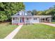 Charming single Gathering home featuring a inviting front porch and a well-maintained lawn at 60 Hunter Bridge Rd, Stony Point, NC 28678