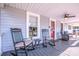 Inviting front porch with rocking chairs and ceiling fan at 60 Hunter Bridge Rd, Stony Point, NC 28678