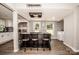 Modern kitchen with stainless appliances, an island with barstool seating, and lots of natural light at 60 Hunter Bridge Rd, Stony Point, NC 28678