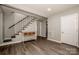 Inviting living room featuring hardwood floors and staircase access at 60 Hunter Bridge Rd, Stony Point, NC 28678