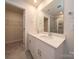 Bathroom features a double vanity, granite countertops, large mirror and glass enclosed shower at 158 Shepherds Landing Dr, Mooresville, NC 28115