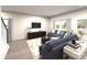 Inviting living room with contemporary furnishings, hardwood floors, neutral color palette, and natural light at 158 Shepherds Landing Dr, Mooresville, NC 28115