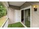 Private balcony with sliding door access and artificial turf at 140 Lake Concord Ne Rd # D9, Concord, NC 28025