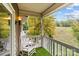 Relaxing balcony with rocking chairs and wooded views at 140 Lake Concord Ne Rd # D9, Concord, NC 28025