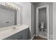 Clean bathroom with vanity, mirror, and toilet at 140 Lake Concord Ne Rd # D9, Concord, NC 28025