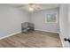 Bright bedroom with wood-look floors and a crib at 140 Lake Concord Ne Rd # D9, Concord, NC 28025