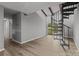 Living room with spiral staircase and sliding glass door leading to outdoor space at 140 Lake Concord Ne Rd # D9, Concord, NC 28025