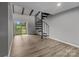 Living room with sliding door and spiral staircase at 140 Lake Concord Ne Rd # D9, Concord, NC 28025