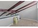 Bright loft space with wood beams and carpet flooring at 140 Lake Concord Ne Rd # D9, Concord, NC 28025