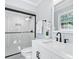 Clean bathroom with white vanity, black fixtures, and glass shower at 7501 Limerick Dr, Charlotte, NC 28270