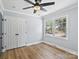 Light and airy bedroom with hardwood floors and double door closet at 7501 Limerick Dr, Charlotte, NC 28270