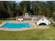 Exterior view of community pool and surrounding areas including pool house and landscaping at 837 Lake Forest Dr # Nottingham, Belmont, NC 28012