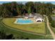 Community pool showcasing the pool house and lounging area surrounded by a fence at 837 Lake Forest Dr # Nottingham, Belmont, NC 28012