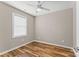 Simple bedroom with wood-look flooring and ceiling fan at 1528 28Th Street Se Pl, Hickory, NC 28602