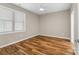 Bright bedroom with wood-look flooring and neutral walls at 1528 28Th Street Se Pl, Hickory, NC 28602