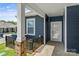 Inviting front entrance with a covered porch and neutral siding at 1528 28Th Street Se Pl, Hickory, NC 28602