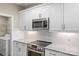 Modern kitchen features stainless steel appliances and white shaker cabinets at 1528 28Th Street Se Pl, Hickory, NC 28602