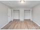 Bright bedroom featuring wood-look flooring, closet and two closets at 2515 Winterfield Dr, Gastonia, NC 28056