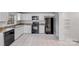 Efficient kitchen with white cabinets, granite countertops, and modern appliances at 2515 Winterfield Dr, Gastonia, NC 28056