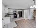 Kitchen features white cabinetry and black appliances, creating a clean and modern cooking space at 2515 Winterfield Dr, Gastonia, NC 28056