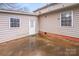 Exterior view of patio featuring concrete floors, white door, and siding, perfect for outdoor entertaining at 2515 Winterfield Dr, Gastonia, NC 28056