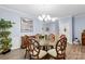 Bright dining room featuring a glass-top table and wood chairs at 7223 Meyer Rd, Fort Mill, SC 29715