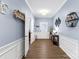 Bright entryway with hardwood floors, a decorative table, and wall decor at 7223 Meyer Rd, Fort Mill, SC 29715