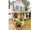 Front porch of a two-story house with landscaping and seasonal decor at 7223 Meyer Rd, Fort Mill, SC 29715