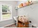 Laundry room with utility sink, shelving, and window at 7223 Meyer Rd, Fort Mill, SC 29715