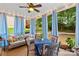 Relaxing screened porch with seating area and wooded views at 7223 Meyer Rd, Fort Mill, SC 29715