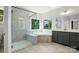 Bathroom features a glass shower, soaking tub, double vanity and tile floors at 3229 Mcharney Dr # 30, Harrisburg, NC 28075