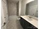 This bathroom features a shower-tub, marble tile surround and vanity at 3229 Mcharney Dr # 30, Harrisburg, NC 28075