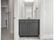 Chic bathroom vanity with a modern gray cabinet, a white countertop, and stylish fixtures at 3229 Mcharney Dr # 30, Harrisburg, NC 28075