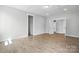 Large bedroom with hardwood floors and two doorways at 3229 Mcharney Dr # 30, Harrisburg, NC 28075