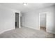 Bedroom with neutral walls and carpet, multiple doorways and walk-in closet at 3229 Mcharney Dr # 30, Harrisburg, NC 28075