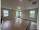 Expansive bonus room filled with natural light from multiple windows, offering versatile living space at 3229 Mcharney Dr # 30, Harrisburg, NC 28075