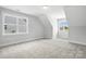 Spacious bonus room with carpet, natural light and ample space at 3229 Mcharney Dr # 30, Harrisburg, NC 28075