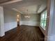 Dining area with wainscoting, coffered ceilings, modern chandelier, and wood flooring at 3229 Mcharney Dr # 30, Harrisburg, NC 28075
