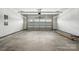 Spacious two-car garage with ample room for vehicles, storage, and a convenient automatic door opener at 3229 Mcharney Dr # 30, Harrisburg, NC 28075