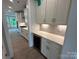 Modern kitchen with custom cabinets, granite countertops, stainless steel appliances, and wine cooler at 3229 Mcharney Dr # 30, Harrisburg, NC 28075