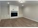 Living room with built-in cabinets and electric fireplace at 3229 Mcharney Dr # 30, Harrisburg, NC 28075