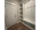 Bright mudroom with built-in shelving and coat rack, perfect for organization and storage at 3229 Mcharney Dr # 30, Harrisburg, NC 28075