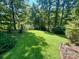 Expansive, well-maintained backyard with lush green grass and mature trees, perfect for outdoor activities at 460 27Th Avenue Nw Cir, Hickory, NC 28601