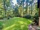 Expansive, well-maintained backyard with lush green grass and mature trees, perfect for outdoor activities at 460 27Th Avenue Nw Cir, Hickory, NC 28601
