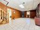 Spacious basement featuring paneled walls, tile flooring, and a cozy corner, perfect for versatile use at 460 27Th Avenue Nw Cir, Hickory, NC 28601