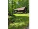 Exterior view of a unique home design featuring a sloped yard and tasteful landscaping in a wooded setting at 460 27Th Avenue Nw Cir, Hickory, NC 28601